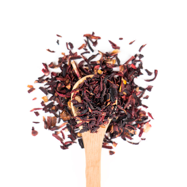 Wooden spoon of Organic Hibiscus on a white background.