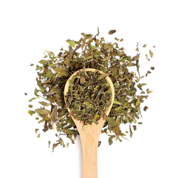 Organic peppermint on a wooden spoon.